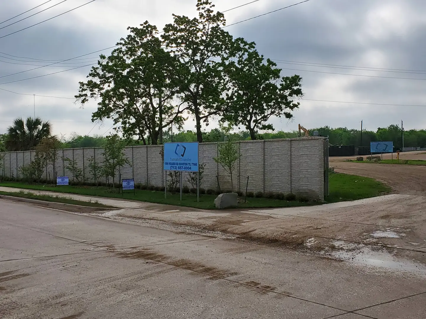 Roadside view of the Tannahill Transfer property and signs on Holmes Road
